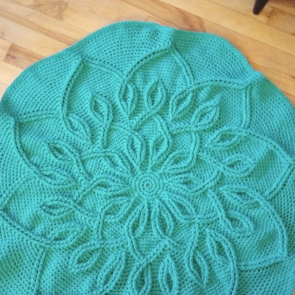 Hand made celtic knot rug. 37in in diameter. Teal in color.